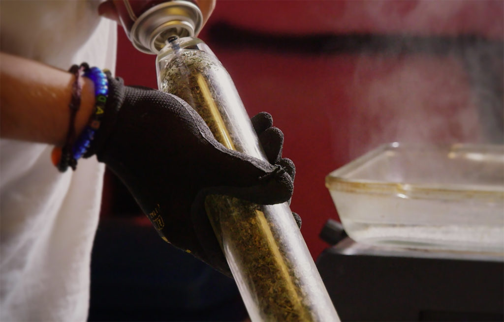 Close up of butane extraction process